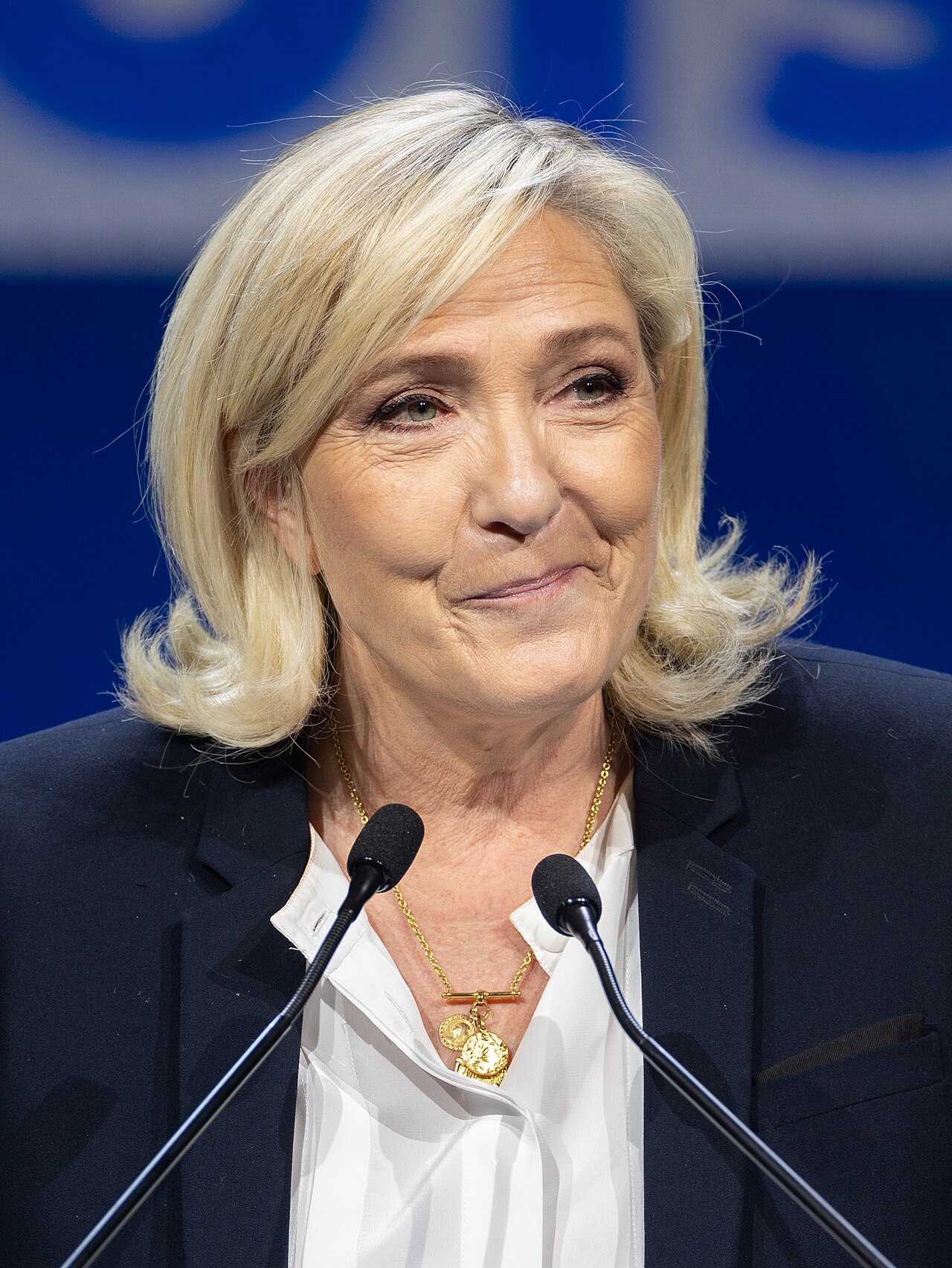 Marine Le Pen, leader of the Rassemblement National — the woman who took a party her father had made synonymous with French neo-Nazism, rebuilt it around a consistent program of immigration restriction, national sovereignty, and opposition to NATO-Israeli strategic alignment, and came within striking distance of the French presidency. She received 41.5% in the 2022 presidential run-off. Her party was the largest French party in the 2024 European Parliament elections. She is facing criminal prosecution whose timing, in the run-up to the 2027 presidential race, has been characterized by her legal team and her millions of supporters as politically motivated. Photo: Wikimedia Commons