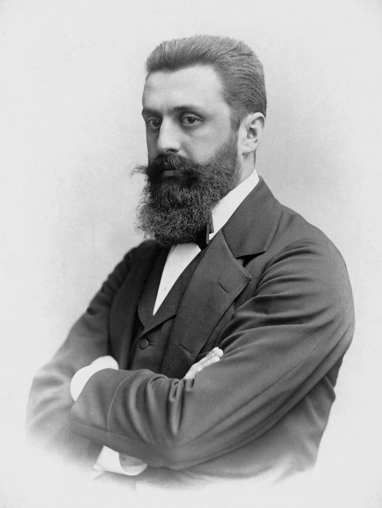 Theodor Herzl (1860–1904) — founder of modern political Zionism. His original vision, articulated in Der Judenstaat (1896) and Altneuland (1902), was explicitly defensive and pluralist: a safe homeland for a persecuted people, where Arab and Jewish inhabitants would live as civic equals. He died decades before Israeli statehood and left no blueprint for settlement expansion, permanent military occupation, or the use of American foreign policy as an instrument of Israeli security doctrine. The distance between what he envisioned and what political Zionism became is the distance Churchill's warning now covers. Photo: Wikimedia Commons