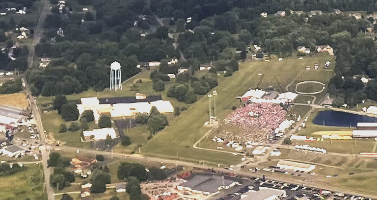 Butler, Pennsylvania — July 13, 2024. Seconds after a gunman opened fire at a Trump campaign rally, the former president rose from behind the podium with blood on his face and ear, raised his fist, and mouthed
