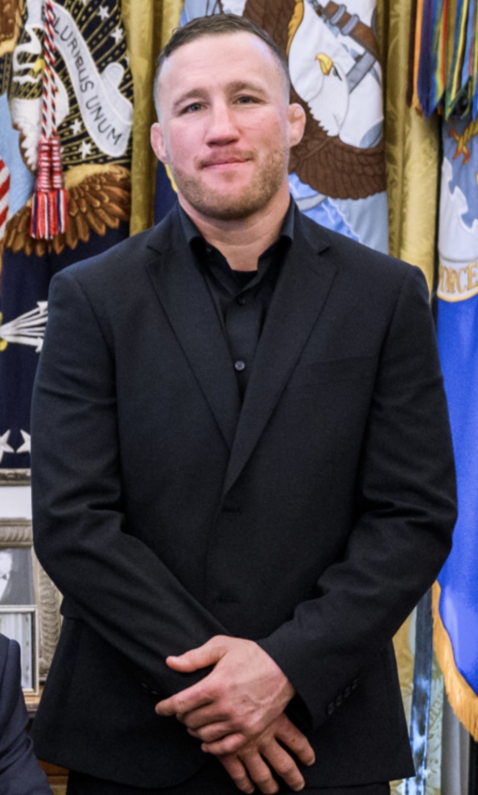 Justin Gaethje in the Oval Office. The son of a copper miner and a postmaster from Safford, Arizona, Gaethje is half-Mexican and half-German, and after the win he stood draped in the American flag, proud and exactly where he wanted to be. Photo: Wikimedia Commons